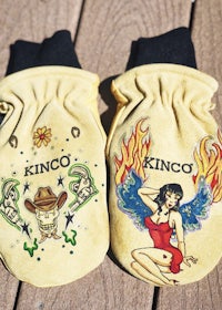 a pair of mittens with the name kingco on them