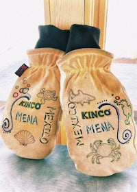 two mittens with the words kingo mena on them